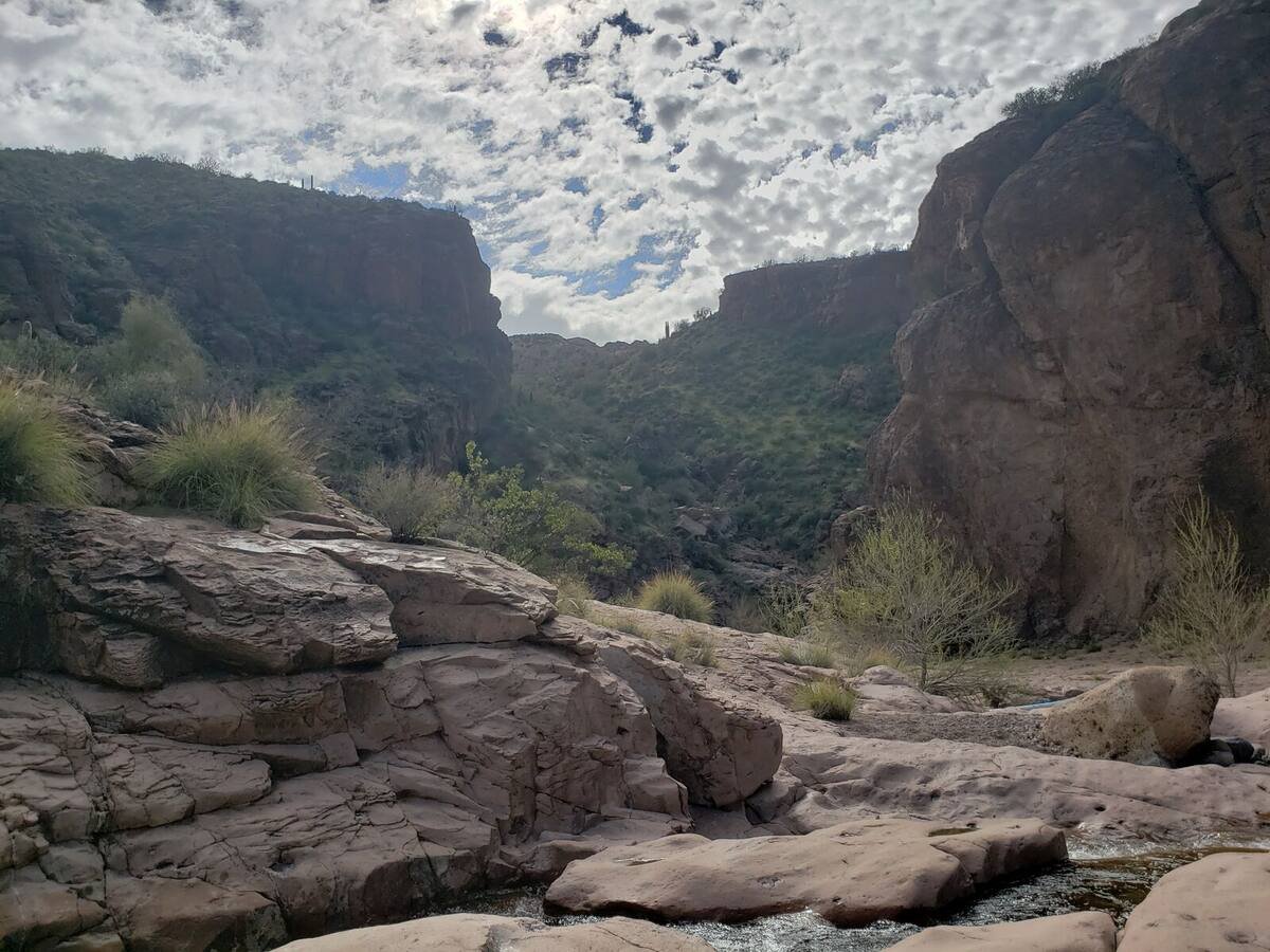 Canyon walls under a cloudy sky at the back of Canyon Lake